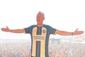 The 58-year-old was headlining On The Beach festival and wore the new home shirt on stage.