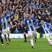 Brighton and Hove Albion midfielder Alexis Mac Allister celebrates his crucial penalty against Brentford