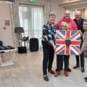 Blind veteran Irene (96), a regular attendee at Blind Veterans Brighton Arts and Crafts Group presents the mosaic