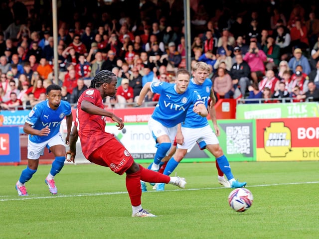 Crawley's Armando Quitirna equalises from the penalty spot and celebrates : Crawley Town drew 1-1 with Stockport County in their League One encounter at the Broadfield Stadium. Stephen Lawrence/Telephoto Images was there to catch the action