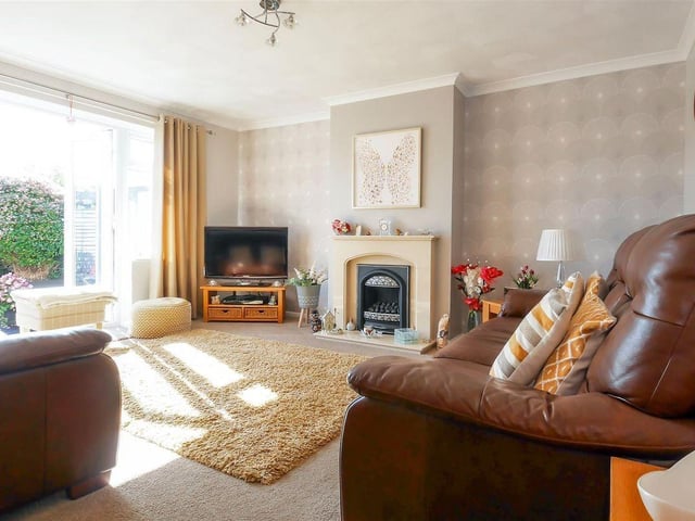 The lounge features French doors to the garden