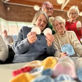 Pam and friends knit love for premature babies. Singing joy, stitching warmth.