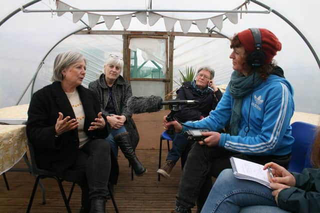 Project team members talking with members of Gather Community Garden, Eastbourne.