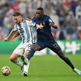 Alexis Mac Allister of Argentina battles for possession with Randal Kolo Muani of France during the World Cup Qatar 2022 final