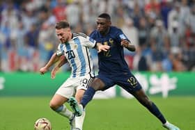 Alexis Mac Allister of Argentina battles for possession with Randal Kolo Muani of France during the World Cup Qatar 2022 final