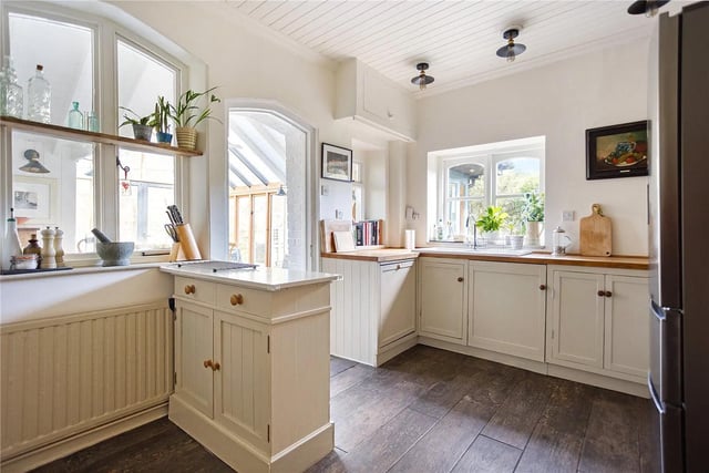 The kitchen leads through to a beautifully light conservatory.
