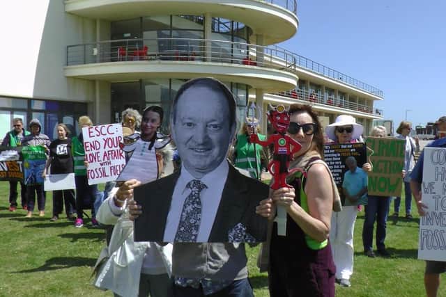 Fossil fuel divestment campaigners with a message for Councillor Ian Hollidge (Bexhill South) outside the De La Warr Pavilion on June 11. Photo from Divest East Sussex