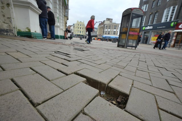 Photo showing the state of the pavement in Hastings town centre. 31/1/24. Wellington Place.