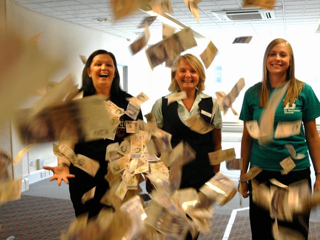 Sloane Vaughan from St Barnabas House, Lorraine Paine from Barclays Bank and former Worthing Herald reporter Sarah Dale with the money raised by the China trip in 2010