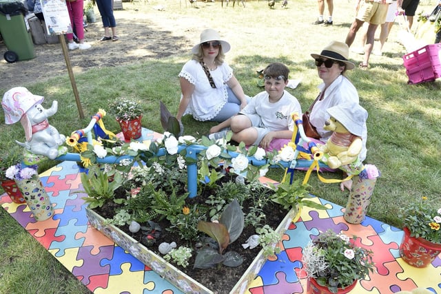 The Garden Show kicked off the weekend at Stansted Park in Rowlands Castle on Friday, June 9. Pictured is: (left) Louise Beeston with Natalie Webster and her son Gabriel (10) all from Fareham, next to the little garden created by Ray Hunt raising money for Cancer Wise.