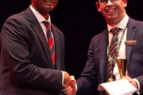 Award being presented to Denver Premathilaka