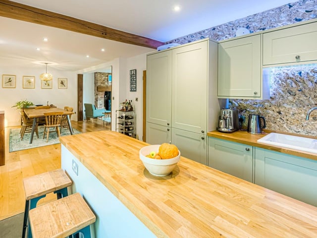 This stunning flint-and-brick detached house dates to the 1800s and used to be a pub. It was converted in about 2016 and boasts four bedrooms, three reception rooms and mature, secluded gardens.
