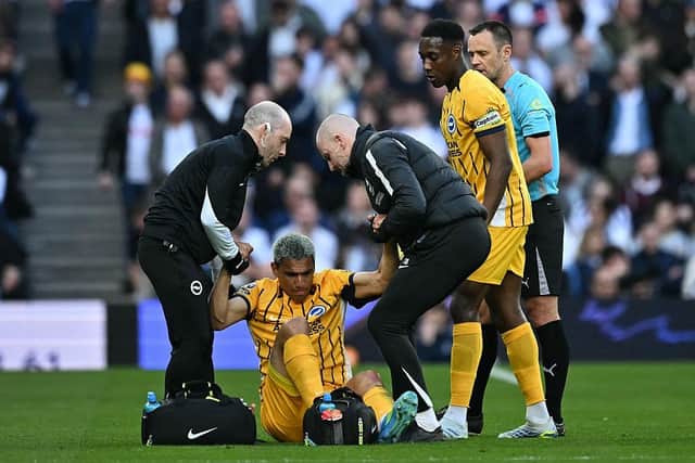 Diego Gomez was forced off early in the match after landing awkwardly in a challenge, with visible discomfort and distress as he left the pitch after 20 minutes. (Photo by Ben STANSALL / AFP via Getty Images)