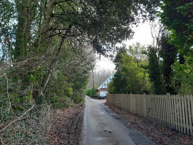 Walk a short way along, past a couple of houses, until you reach a footpath on the left.