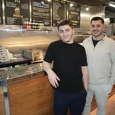 Sahin Saglam (left) and Hamit Ermis (right) are giving away prepaid food at Crispy Cod in Lancing to people who are ‘struggling to make ends meet’.