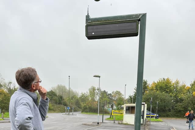 Bob scans a bus information board at Horsham's Hop Oast Park and Ride