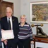 Jack Bennett, with his wife Jenny, receives a certificate of appreciation from Burgess Hill town mayor Peter Chapman.