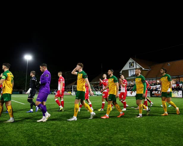 Players of both teams walk out to the field of play prior to the Emirates FA Cup First Round Replay match between Horsham and Barnsley at The Camping World Community Stadium on November 14, 2023 in Horsham, England. (Photo by Charlie Crowhurst/Getty Images)