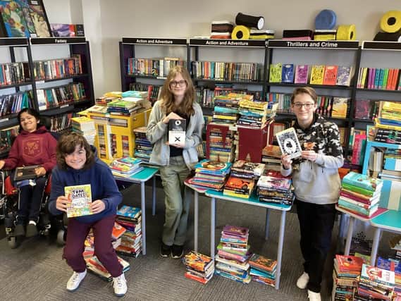 Student library helpers with the donated books at Bohunt Worthing on World Book Day