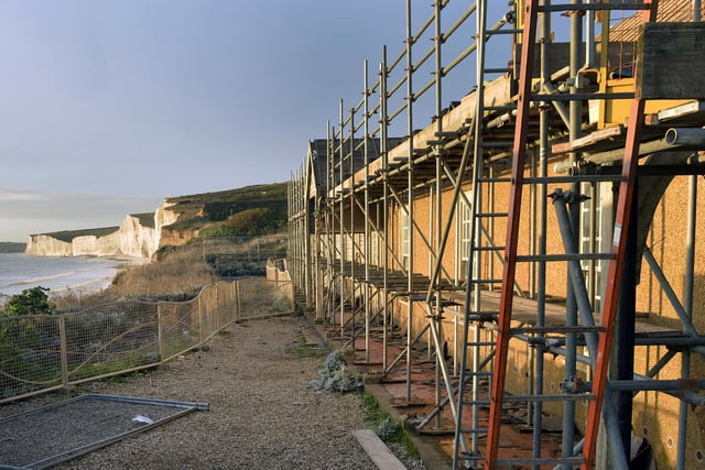 Birling Gap Cafe is dangerously close to the cliff edge due to coastal erosion and is being demolished (Photo by Jon Rigby)