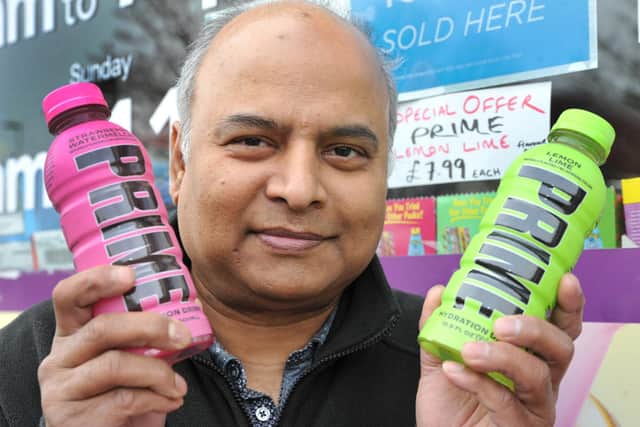 Monammed Robbani with the Prime drinks being sold at Premier Express - the lemon and lime one on offer at £7.99. Photo: Steve Robards SR2303301