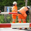 Staff at the level crossing in Adversane Lane, Billingshurst, working to repair the damaged line.