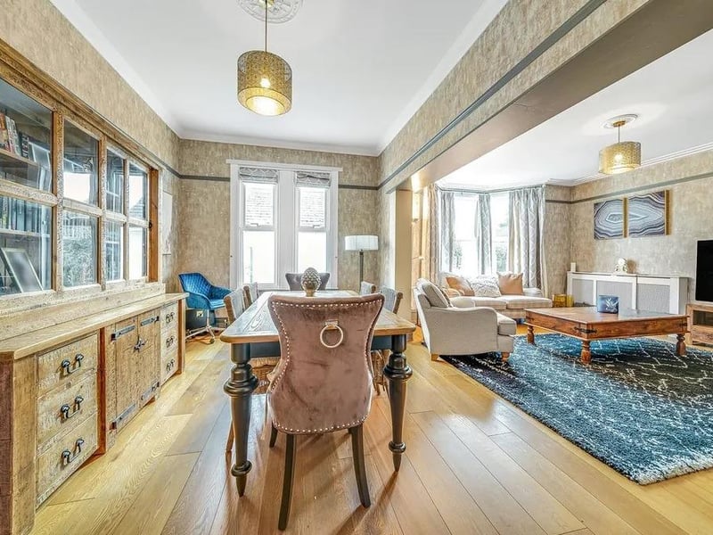 A large reception room combines the living area and dining room into one space