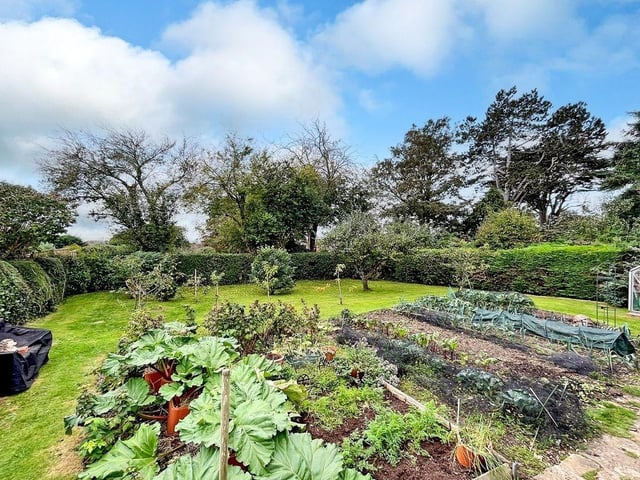 This three-bedroom, detached house with a stunning south-facing garden has come on the market with Graham Butt priced at £695,000