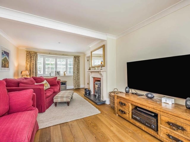 A feature fire place gives the living room a sense of warmth and character.