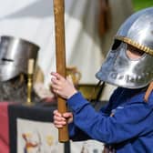 Child taking part in Arundel Castle's Medieval Festival