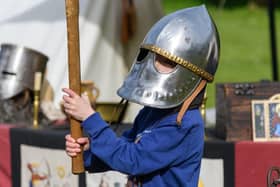 Child taking part in Arundel Castle's Medieval Festival