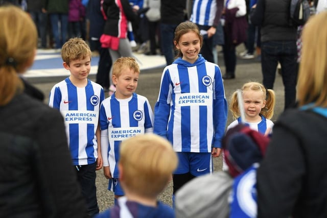 Young Brighton fans pose prior to the Sky Bet Championship match between Brighton and Hove Albion and Wigan Athletic at Amex Stadium on April 17, 2017.