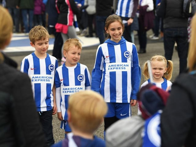 Young Brighton fans pose prior to the Sky Bet Championship match between Brighton and Hove Albion and Wigan Athletic at Amex Stadium on April 17, 2017.