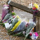 Flowers laid at the scene of the incident. Photo: Eddie Mitchell