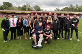 The Crawley Town staff after the team secured survival on the final day