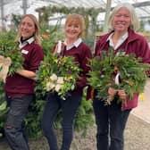 Ace wreath creators (l-r) Plant Manager Kelly Loughlin, and plant assistants Allison Webb and Steph Wickenden at South Downs Nurseries in Hassocks.