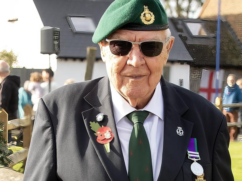 Royal Marine Geoff Baisen, aged 81, at the Selsey Remembrance holding a wreath for the Royal British Legion.
