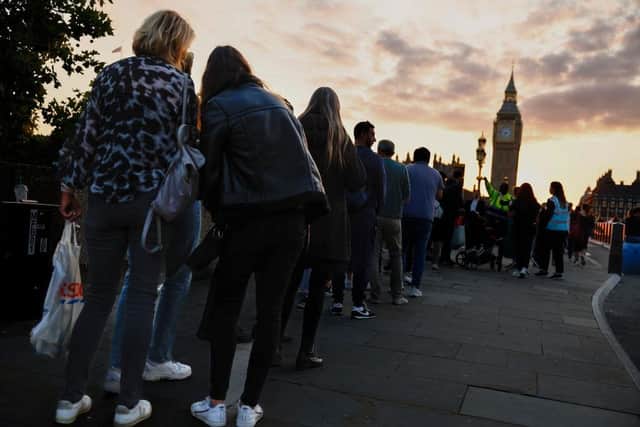 Members of the public stand in the queue for the Lying-in State of Queen Elizabeth II on September 14, 2022 in London, England. (Photo by Jeff J Mitchell/Getty Images)