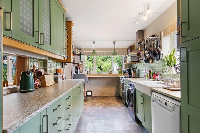 The beautifully equipped kitchen feels modern without sacrificing the property's 1930s charm.