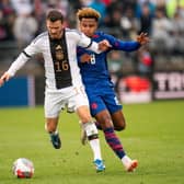 Germany's #16 Pascal Groß and USA's #08 Weston McKennie fight for the ball during the international friendly match between Germany and USA at Pratt & Whitney Stadium, in East Hartford, Connecticut, on October 14, 2023. (Photo by EDUARDO MUNOZ / AFP) (Photo by EDUARDO MUNOZ/AFP via Getty Images)