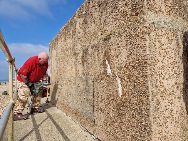 Pete Coe, one of the project leaders, and fellow former Royal Engineer Graham Cosham worked together to open the southern embrasure at the Ferring pillbox