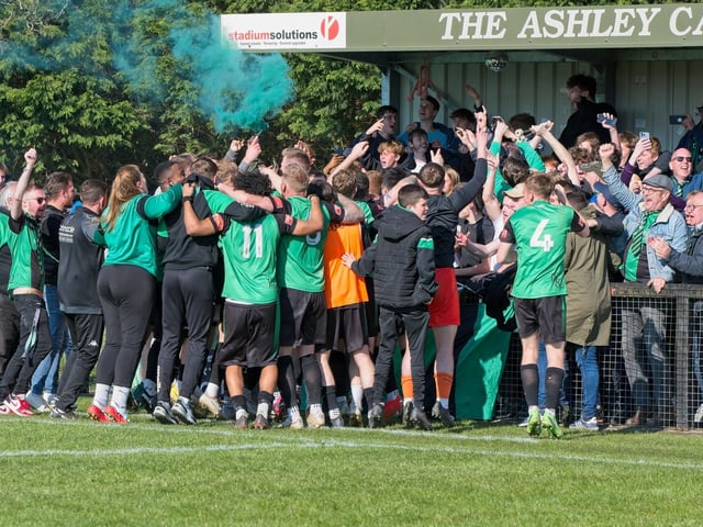 Burgess Hill Town players, fans and staff celebrate surviving in the Isthmian south east division at the end of their 0-0 draw with Beckenham