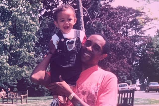 Josh Babarinde as a child with his dad in Hampden Park in Eastbourne