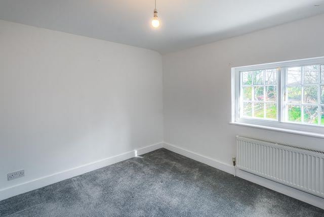 The guest bedroom eenjoys stunning views over the surrounding farm land.