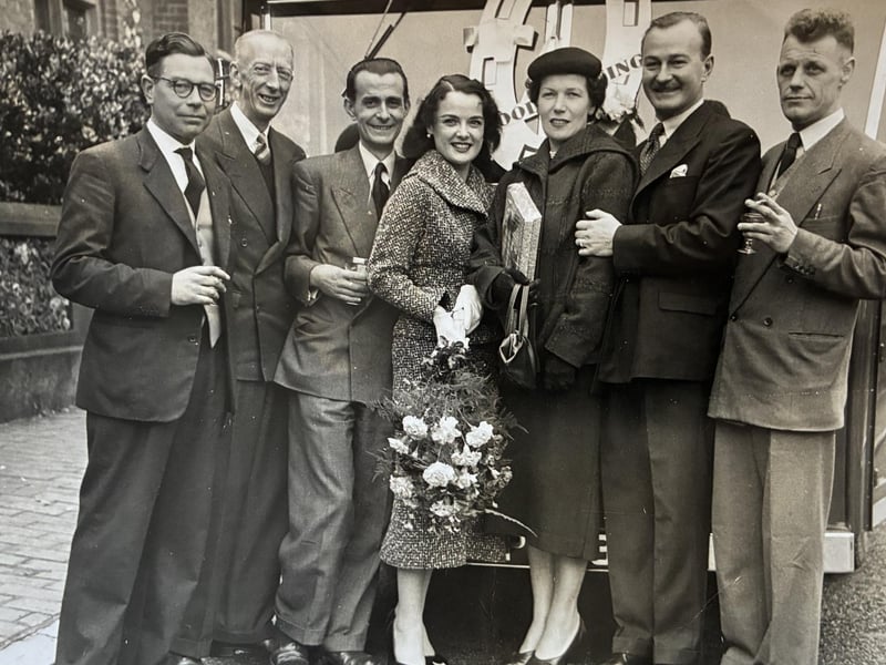 Leslie Tomlin with his wife Heather and staff, greeting a celebrity in the early 1950s