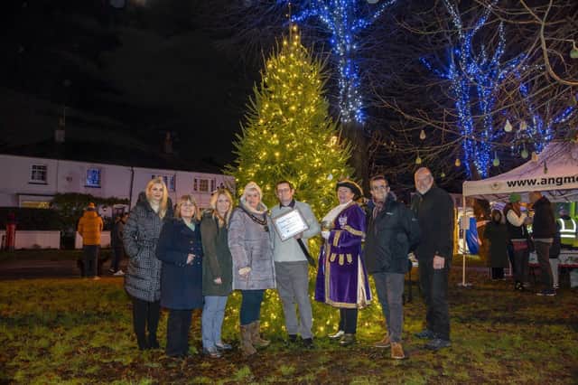 Angmering Grange Team, Ray, Kate, Natalie, Colin, David and Tracey unveiled tree by Bognor Regis Town Crier Jane Smith (3rd from right) and Nikki Hamilton-Street Chair of Angmering Parish Council