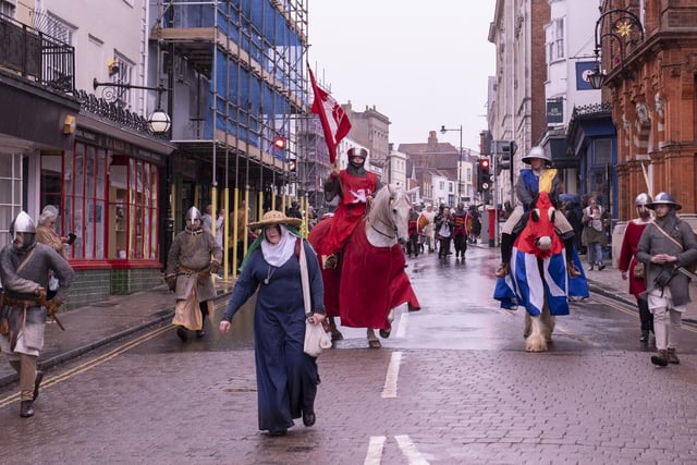The re-enactment through the streets of the town at various points on the High Street, from The Gallops to Lewes Castle, and Lewes Priory.