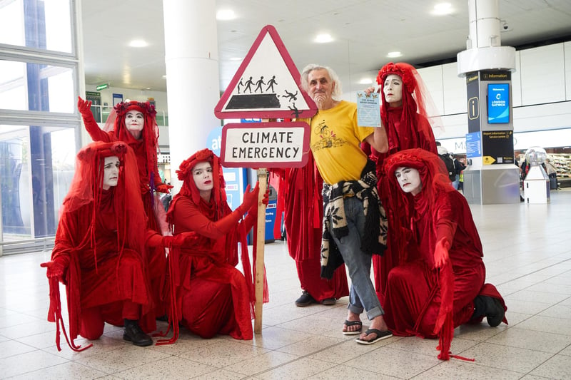 The famous Red Rebels were also there, focussing arriving passengers on the plight of Planet Earth, now acknowledged in 2023 to have warmed to an average of 1.5ºC above the pre-industrial average, which is the government's warming target for 2050.