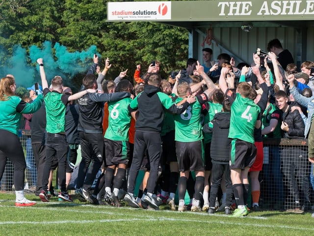 Burgess Hill Town players, fans and staff celebrate surviving in the Isthmian south east division at the end of their 0-0 draw with Beckenham