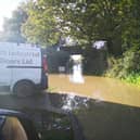 Heavy rain in the city has caused the area and roads around a major housing development in Chichester to flood.